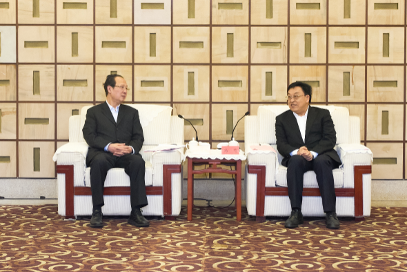 丁焰章拜会海南省委书记冯飞